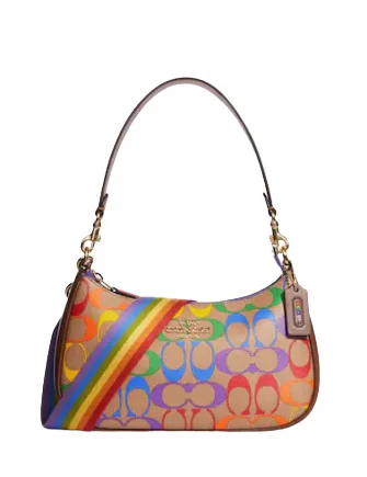 Coach Dempsey bags with a contrast - colored interior for visual interestCoach Teri Shoulder Bag In Rainbow Signature Canvas