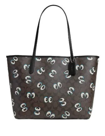 Coach backpacks with a padded laptop sleeve for travel and workCoach City Tote In Signature Canvas With Halloween Eyes