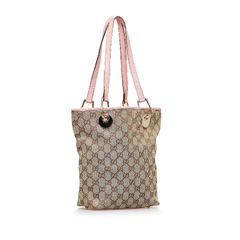 Ladies Gucci Dionysus bags in a pastel colorGucci GG Canvas Eclipse Tote (SHG-Yam187)