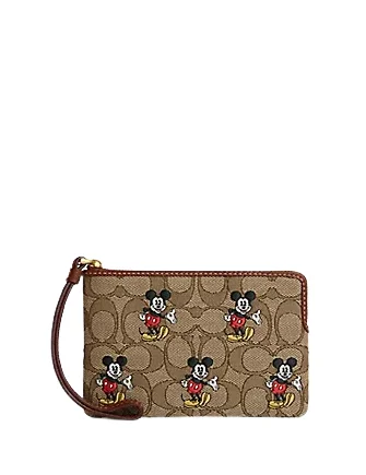 Coach Tabby bags with a classic turnlock closure for a timeless styleCoach Disney X Coach Corner Zip Wristlet In Signature Jacquard With Mickey Mouse Print