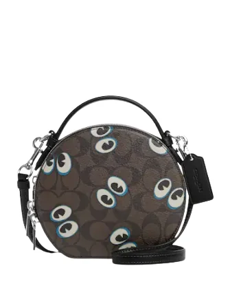 Coach Dempsey bags with a large capacity and a drawstring closureCoach Canteen Crossbody In Signature Canvas With Halloween Eyes